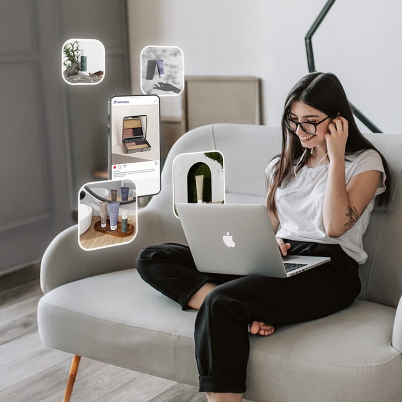 Woman on a sofa with a laptop, surrounded by floating AI-generated cosmetics photos created with loomobox