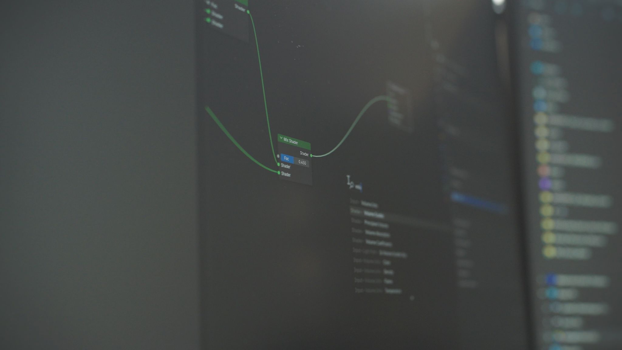 Monitor showing a 3D shader node editor used to build photorealistic product materials for loomobox digital twins