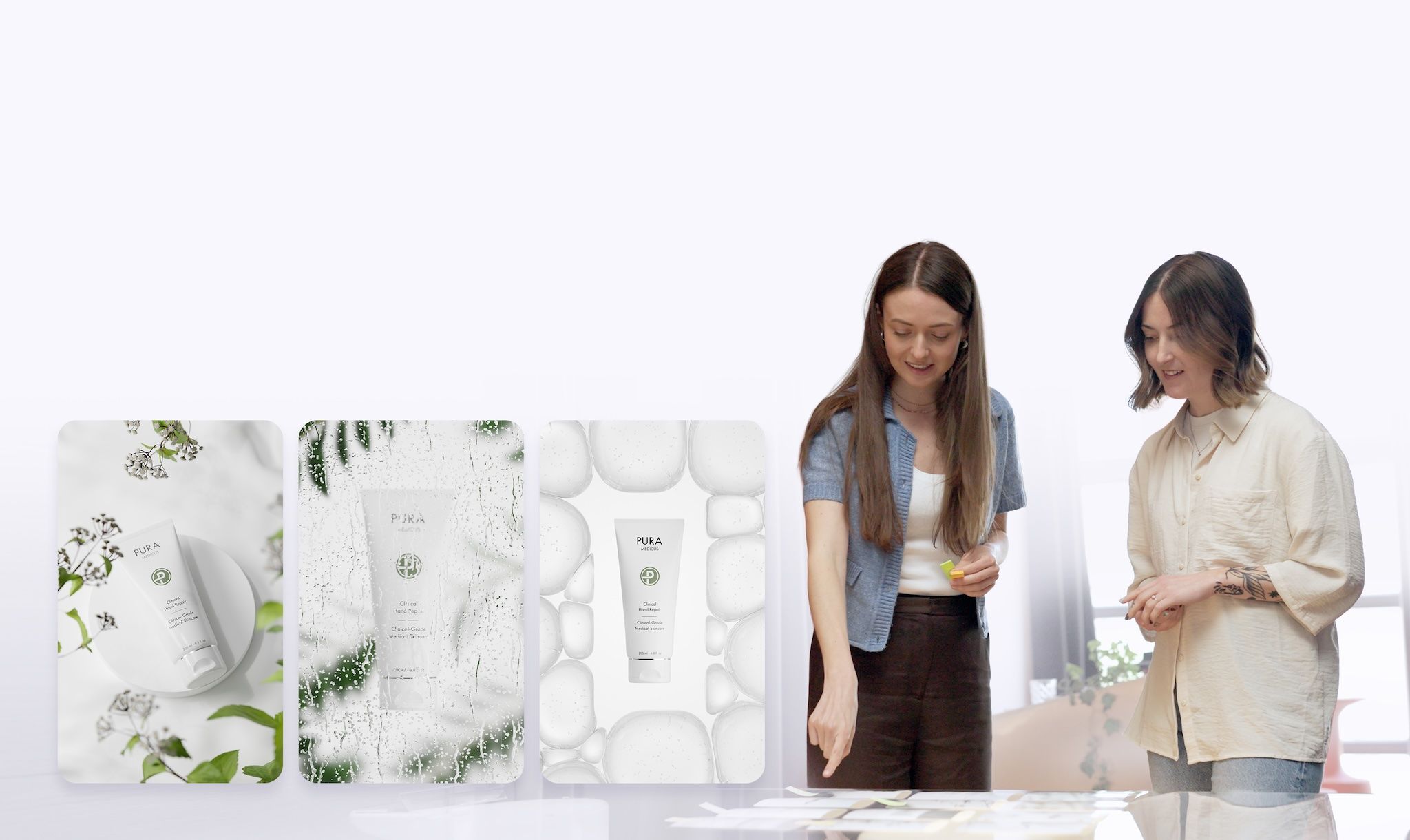 Two loomobox designers reviewing exclusive custom scene concepts for branded skincare product photography