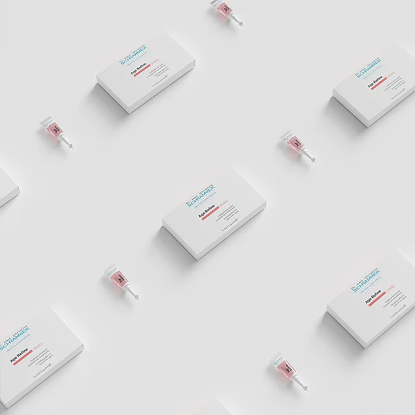 Dr. Schrammek Age Reflow ampoule boxes and pink ampoules in a repeating pattern on white — 3D render created with loomobox
