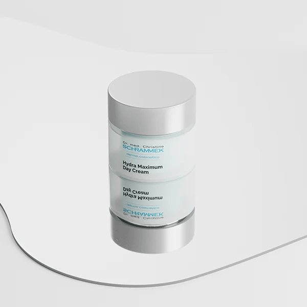 Dr. Schrammek Hydra Maximum Day Cream jar with mirror reflection on a white curved surface — rendered with loomobox