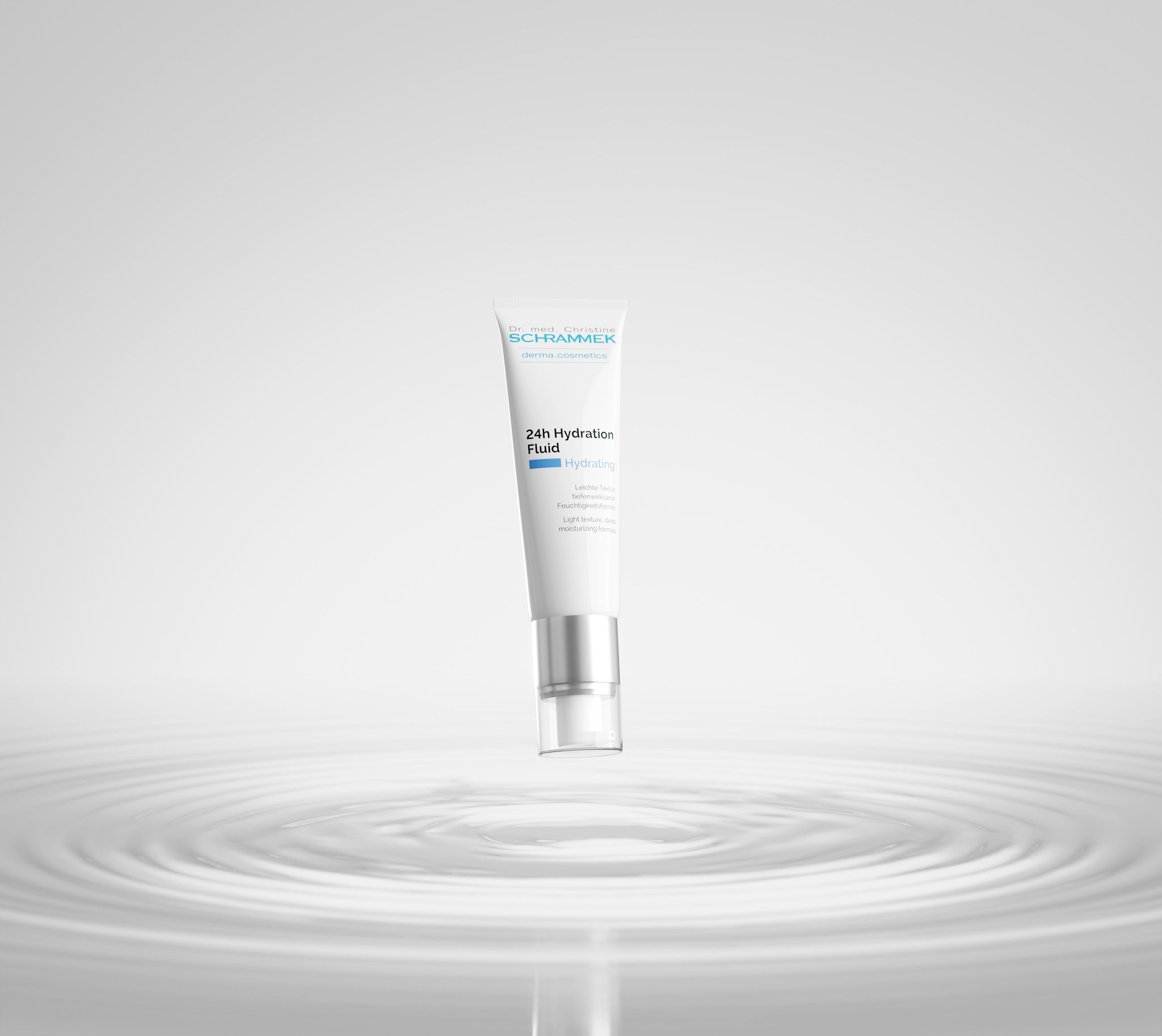 Dr. Schrammek 24h Hydration Fluid tube floating above concentric water ripples