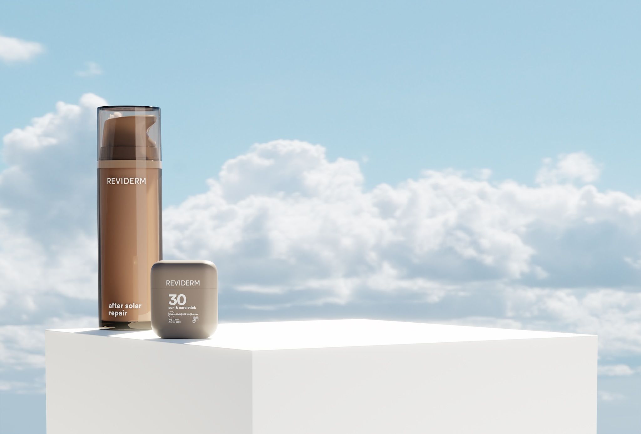 REVIDERM after solar repair bottle and sun & care stick SPF 30 on a white pedestal against a blue sky with clouds