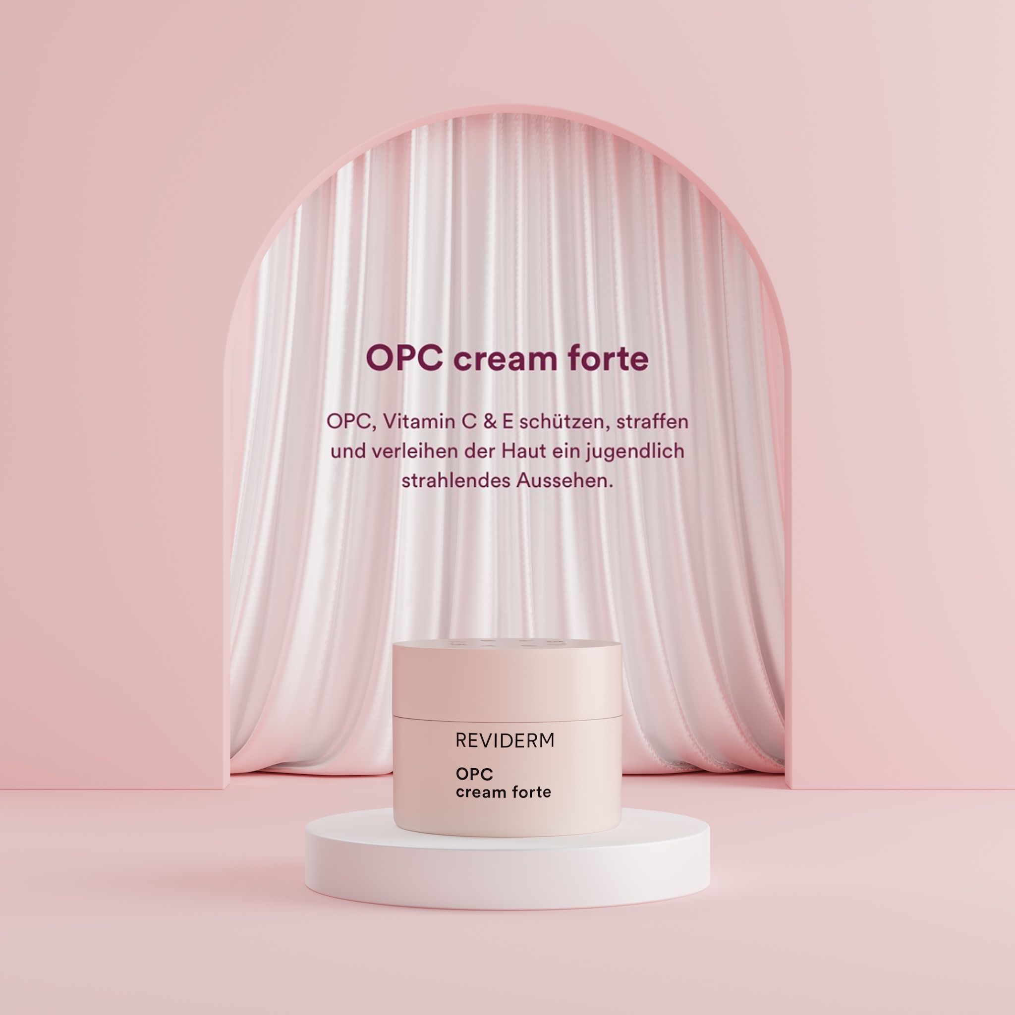 REVIDERM OPC cream forte jar on a white podium in front of a draped curtain and pink arch — "OPC, vitamin C & E protect, firm and give skin a youthfully radiant look"