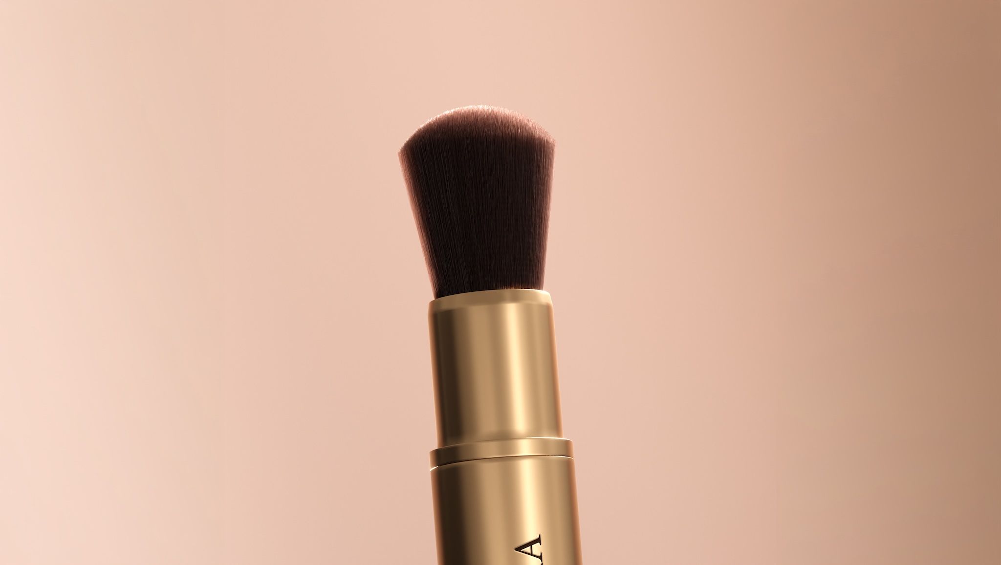 Close-up of a gold makeup brush against a soft nude backdrop — 3D render created with loomobox