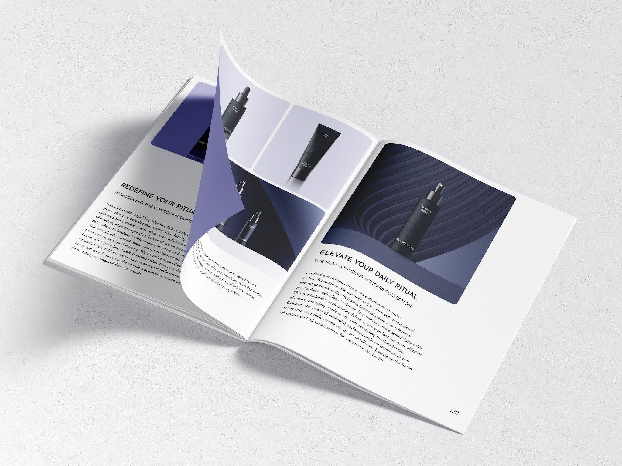 Open magazine spread featuring dark skincare bottles on navy backdrops, product photography rendered with loomobox